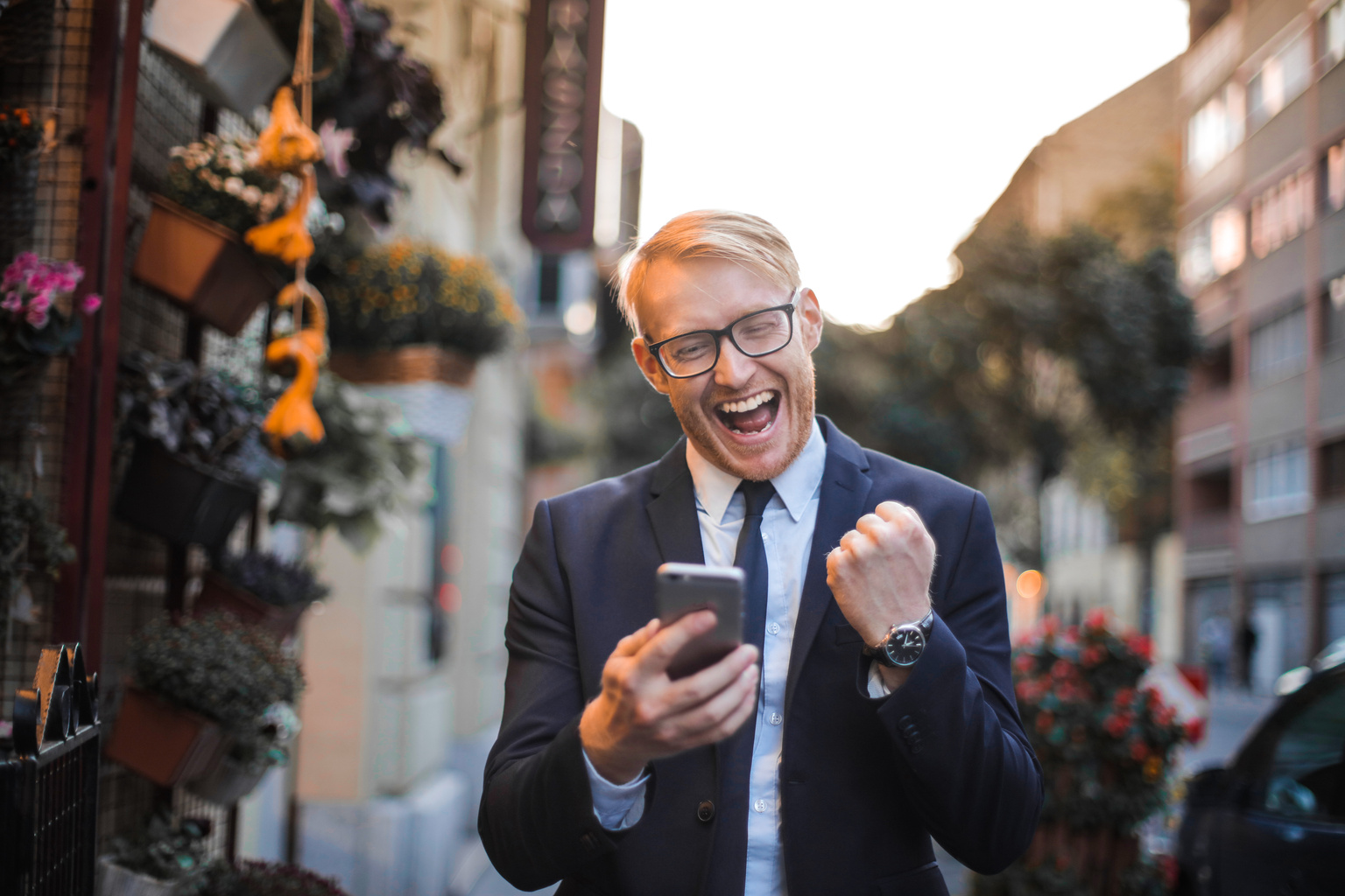 Man in Black Suit Jacket Received A Good News